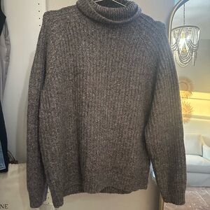 Woman’s brown Turtleneck Sweater